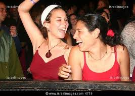 It seems that they can laugh from time to time. Israeli parti goers in Tel Aviv